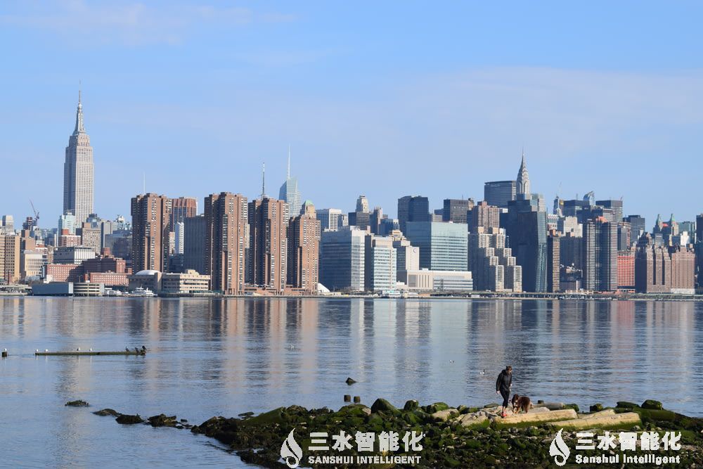 people sitting on rock near body of water du.jpg